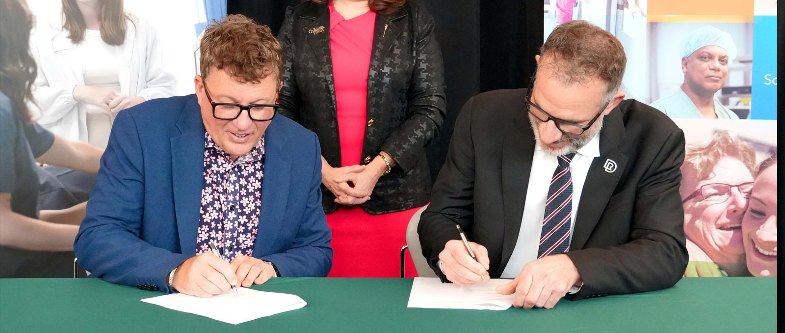 Patrick Dumelie, president and CEO of Covenant, and Stuart Cullum, president, Red Deer Polytechnic, sign agreement to create Rural and Remote Health and Wellness Centre of Excellence.