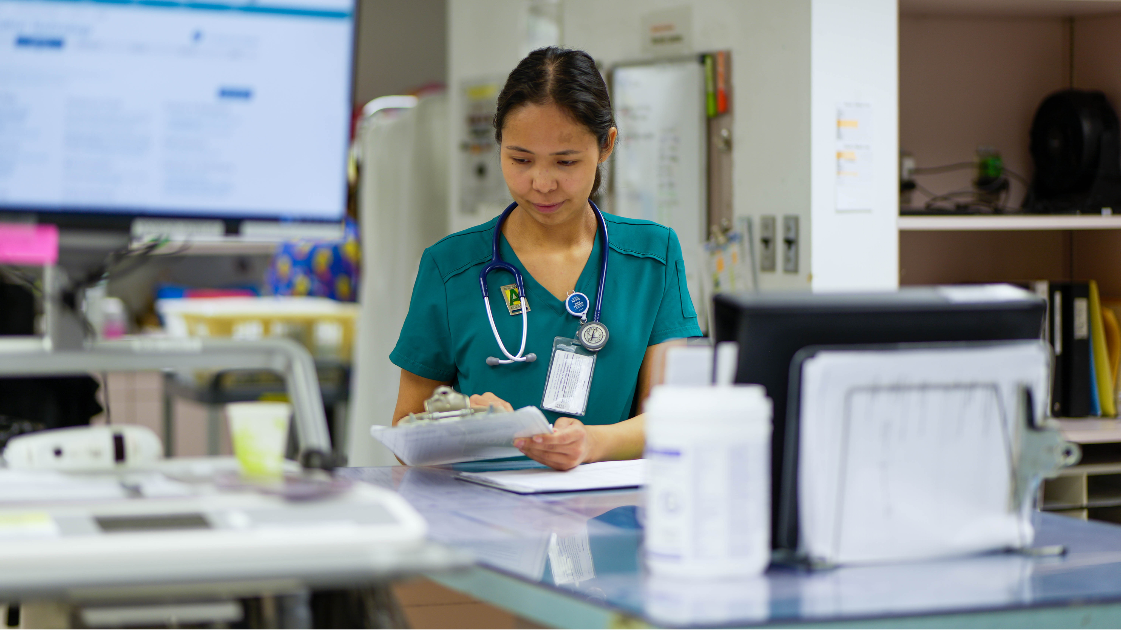 Makayla Mantla reviewing a patient chart on her unit at St. Joseph's General Hospital