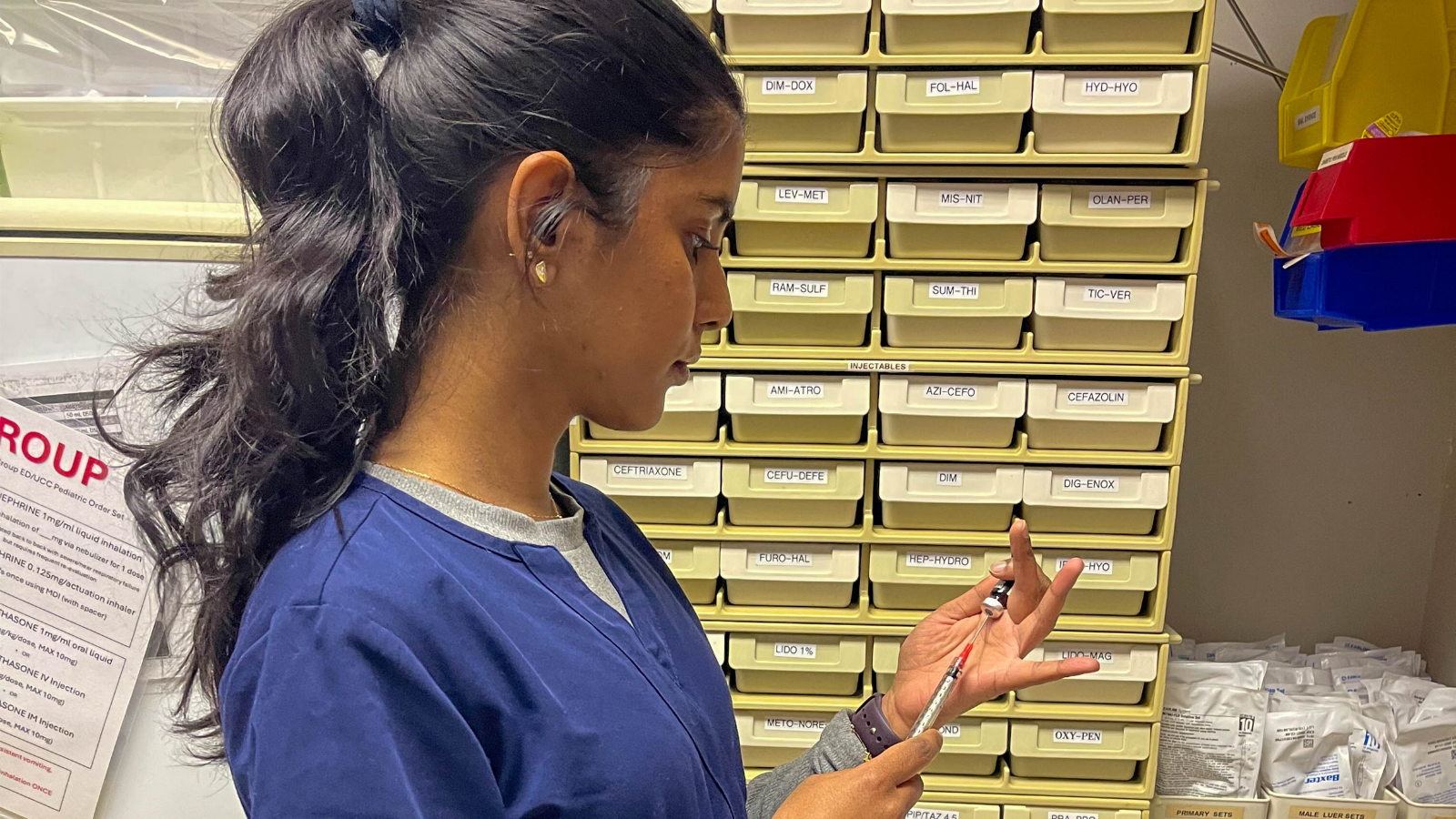 Nurse in blue scrubs working at Bonnyville Health Centre