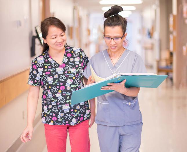 Two Covenant staff walk together