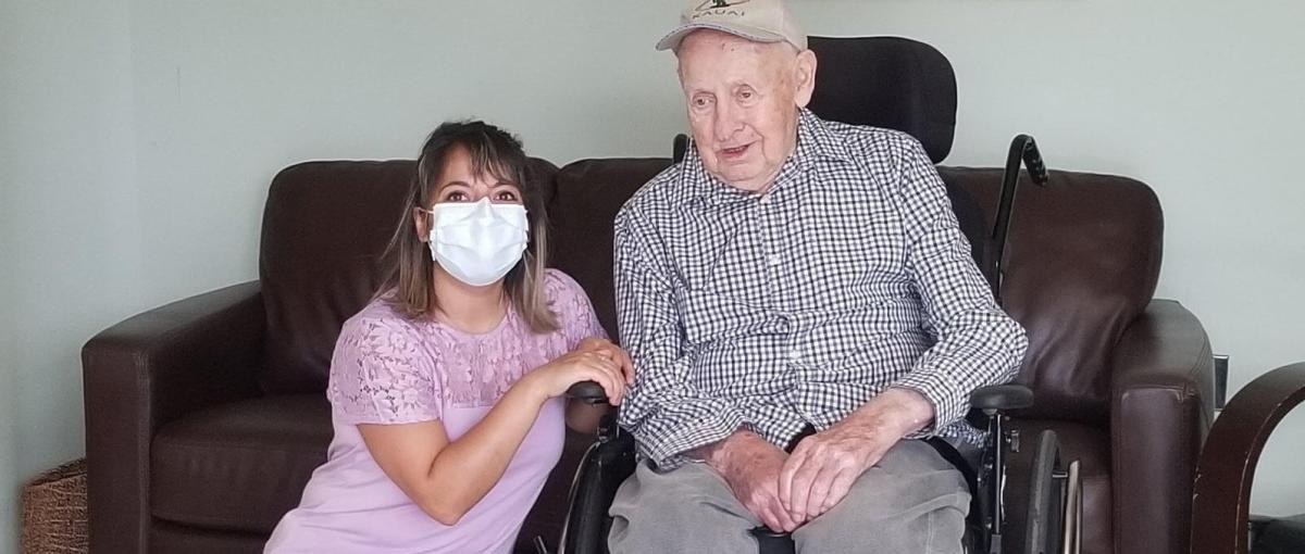 Occupational therapist Sheren Cherri poses with resident Guenter Bork