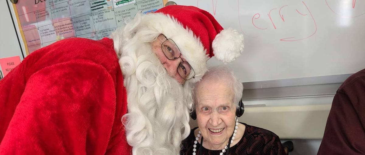 Santa Claus poses with a resident of St. Mary's Health Centre