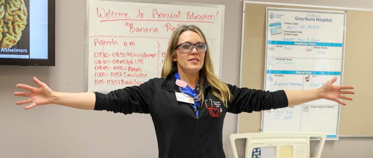 Grey Nuns Community Hospital nurse stretches her arms out in a demonstration