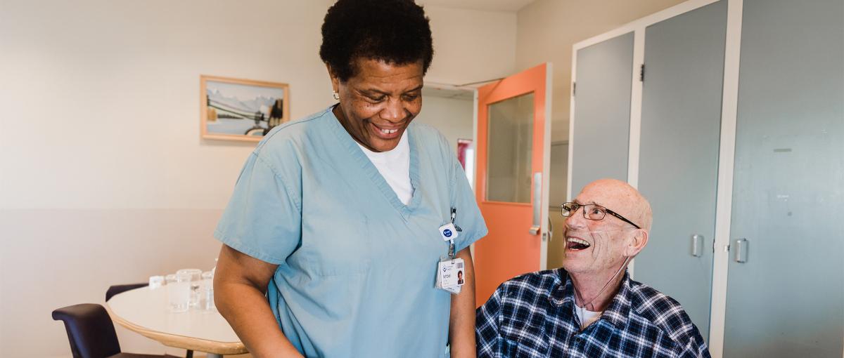 Engaged and Empowered conference logo Nurse interacting with elderly patient