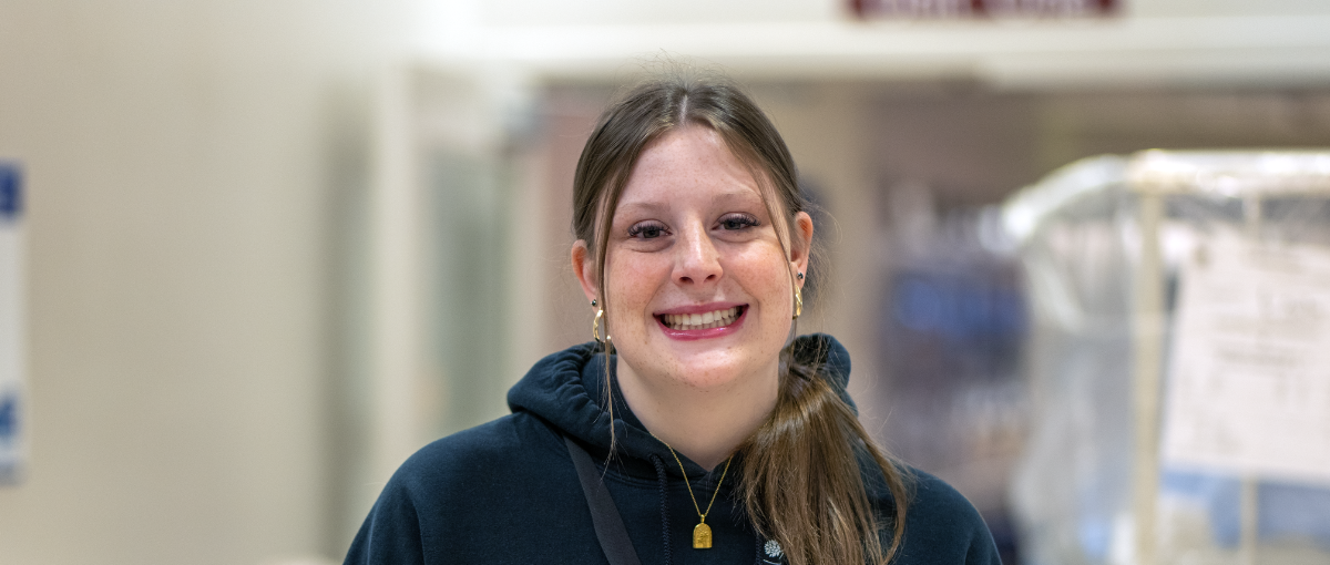 Summer student standing in hospital hallway