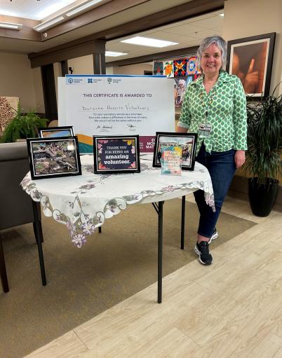 Theresa Bellows stands in the foyer of Dulcina Hospice where she is a volunteer co-ordinator.