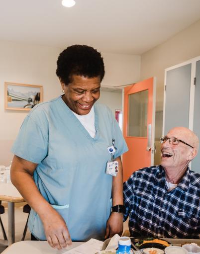 Engaged and Empowered conference logo Nurse interacting with elderly patient