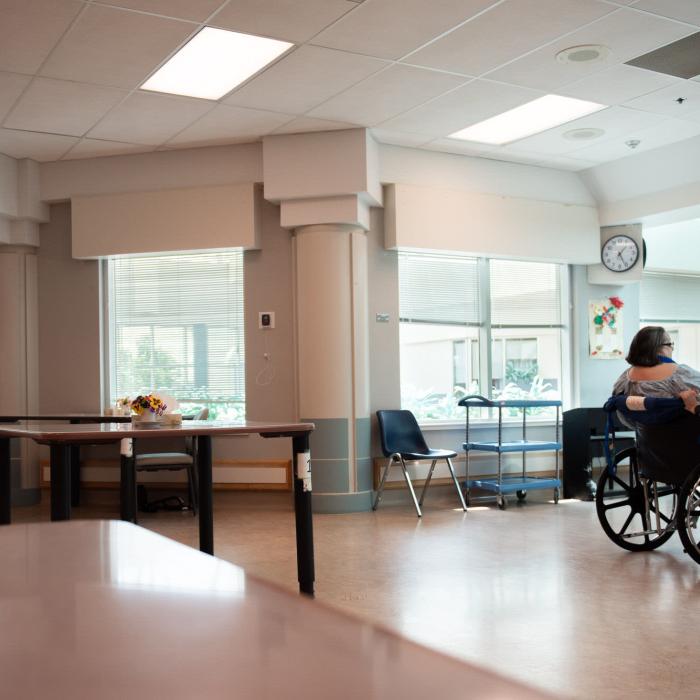 Dining area with tables, chairs and large windows