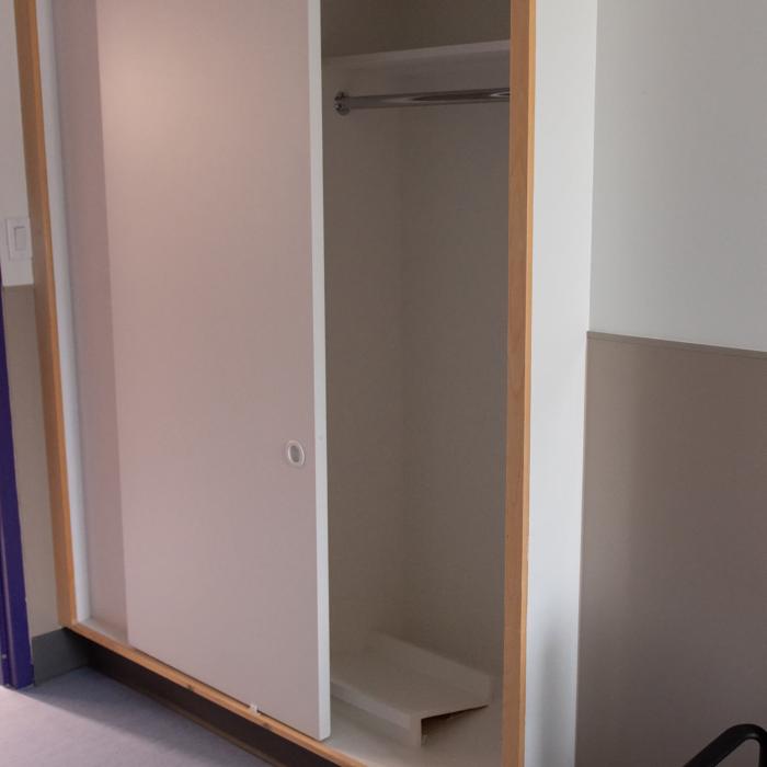 Large white wardrobe with plenty of clothing space