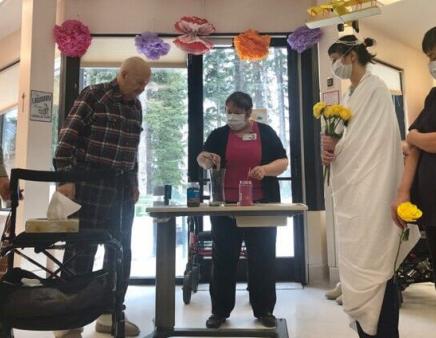 A mock wedding being performed at St. Martha's Place long-term care facility